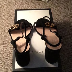 Black Gucci peep heels with gold emblem